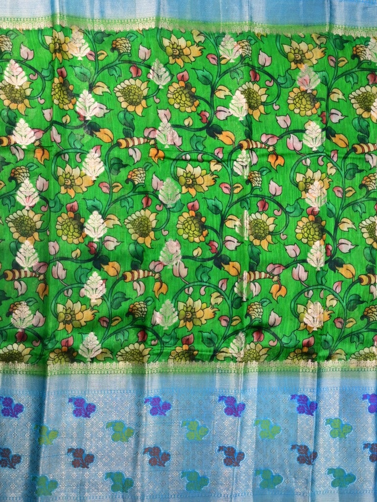 Jute matka fancy saree parrot green color allover prints & big zari border with short pallu and attached brocade blouse