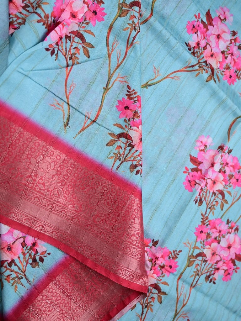 Tussar silk fancy saree sky blue color allover prints & zari border with contrast pallu and attached printed blouse