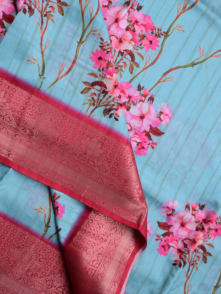 Tussar silk fancy saree sky blue color allover prints & zari border with contrast pallu and attached printed blouse