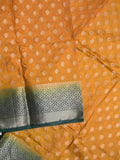 Dupion fancy saree mustard yellow color allover motifs & zari border with contrast pallu and attached blouse
