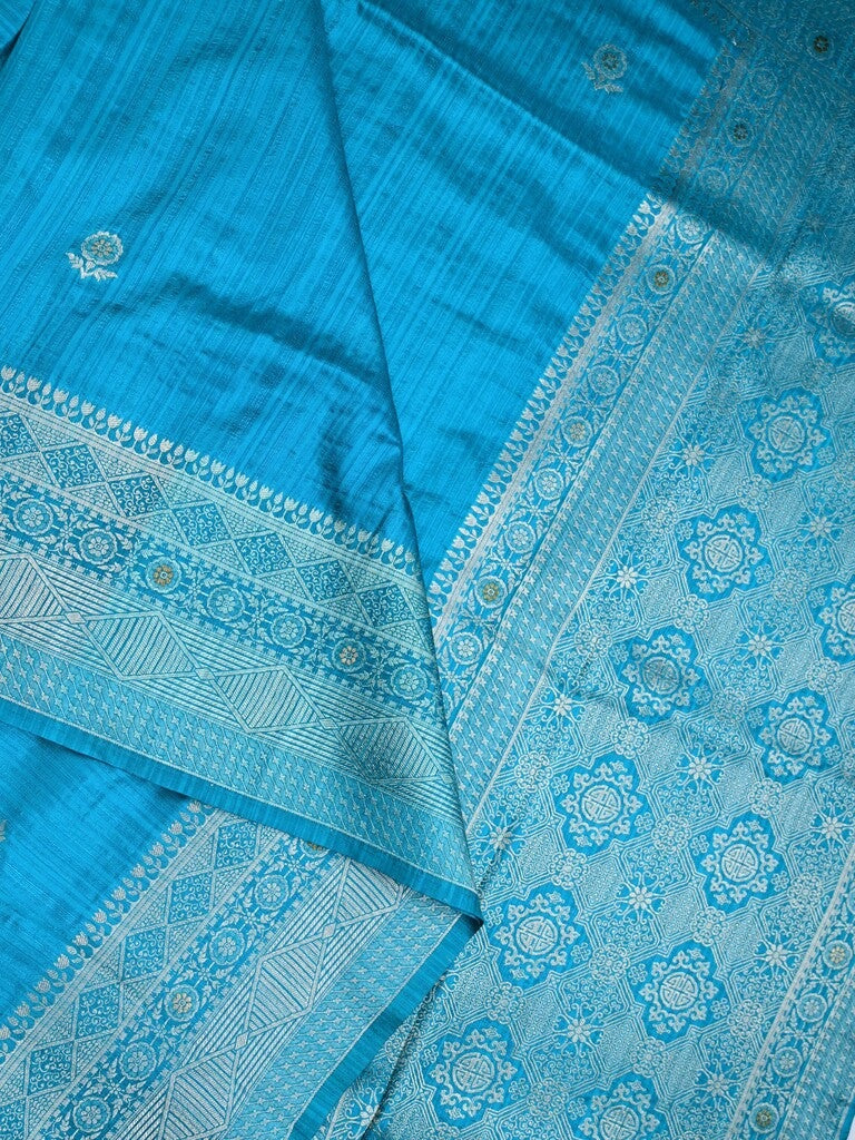 Jute fancy silk saree sky blue color allover zari motifs & zari border with zari weaving pallu and attached blouse