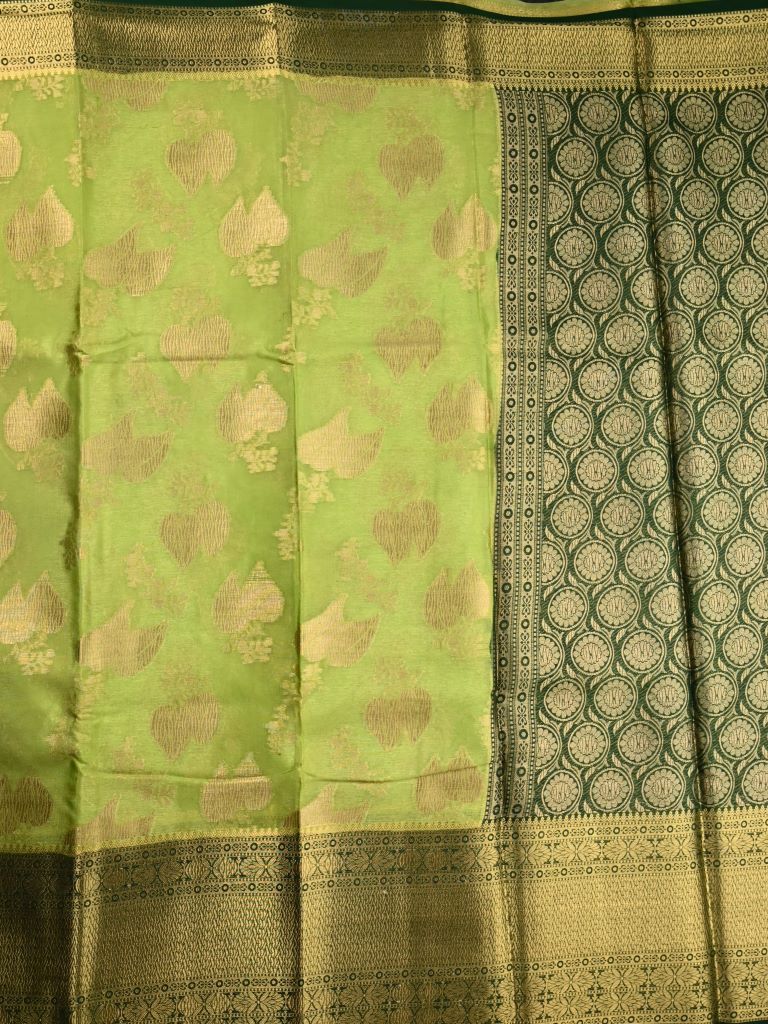 Kora georgette saree green color with allover gold zari weaves, big zari border, short pallu and brocade blouse