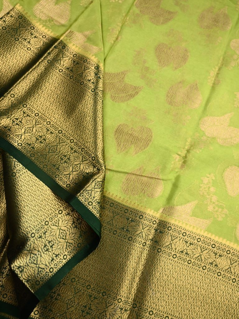 Kora georgette saree green color with allover gold zari weaves, big zari border, short pallu and brocade blouse