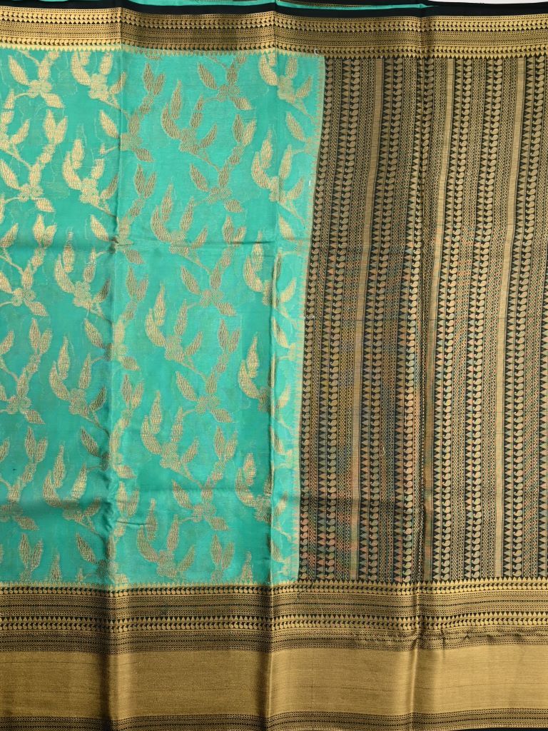Kora georgette saree emerald green color with allover gold zari weaves, big zari border, short pallu and brocade blouse