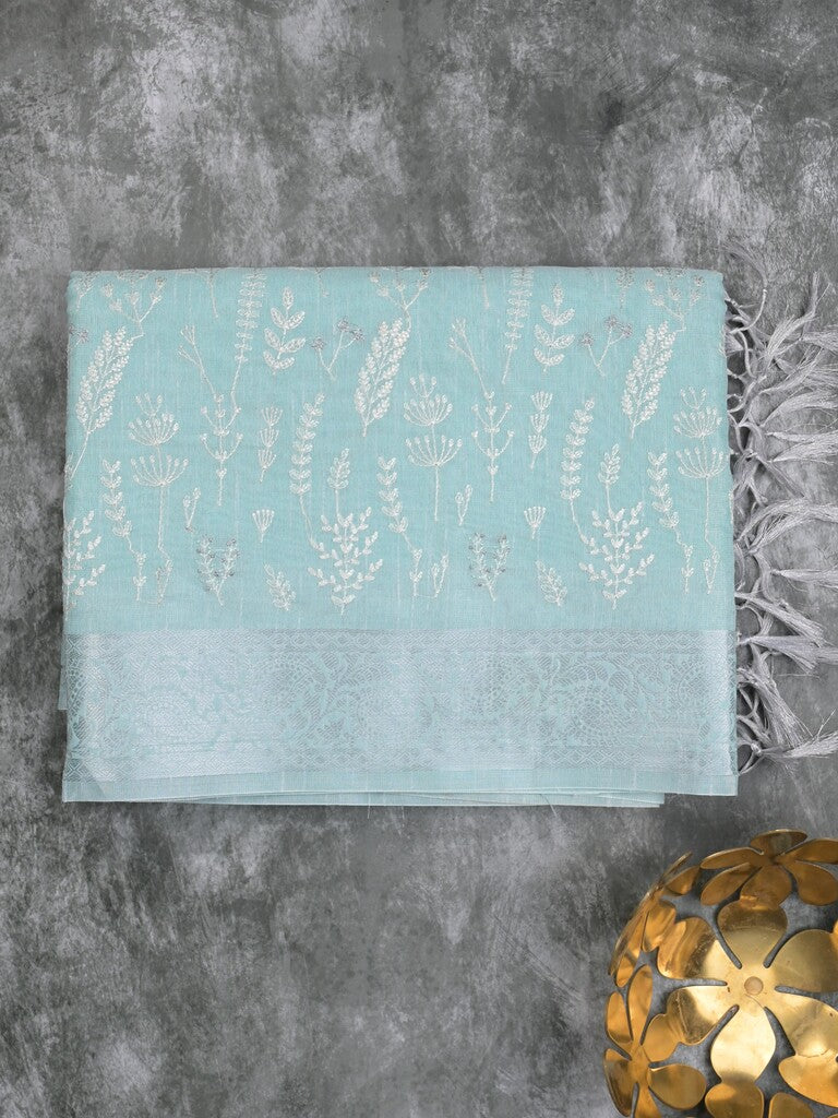 Jute tissue fancy saree sky blue color allover embroidery & zari border with short pallu and plain self blouse