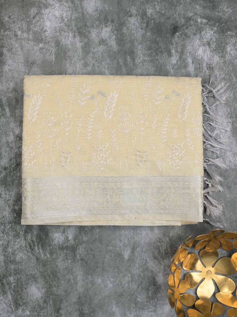 Jute tissue fancy saree light yellow color allover embroidery & zari border with short pallu and plain self blouse