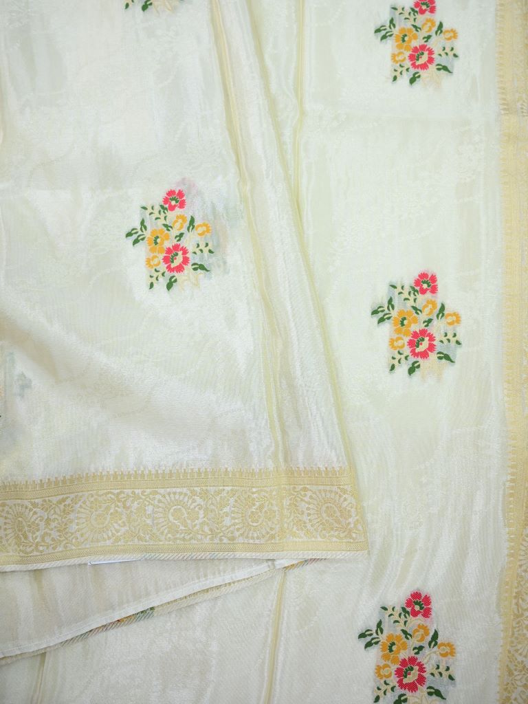 Dola tissue fancy saree white color allover zari weaves & small border with rich pallu and attached plain blouse