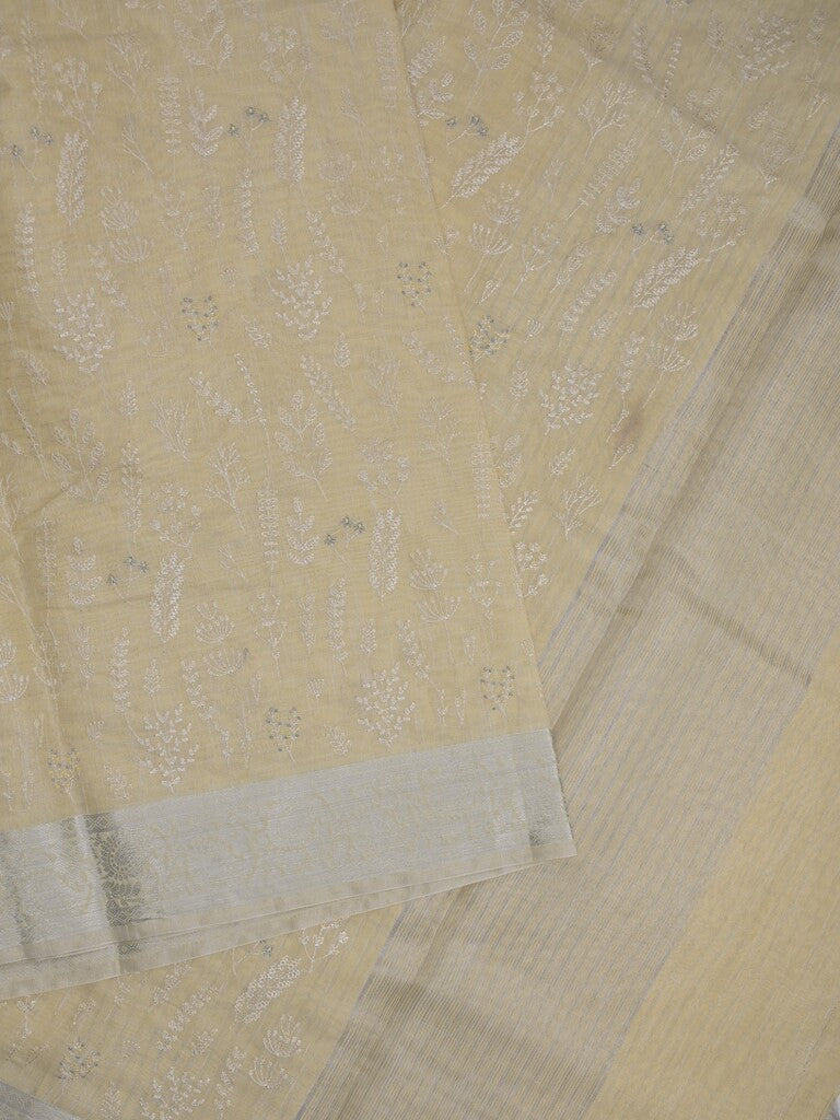 Jute tissue fancy saree light yellow color allover embroidery & zari border with short pallu and plain self blouse