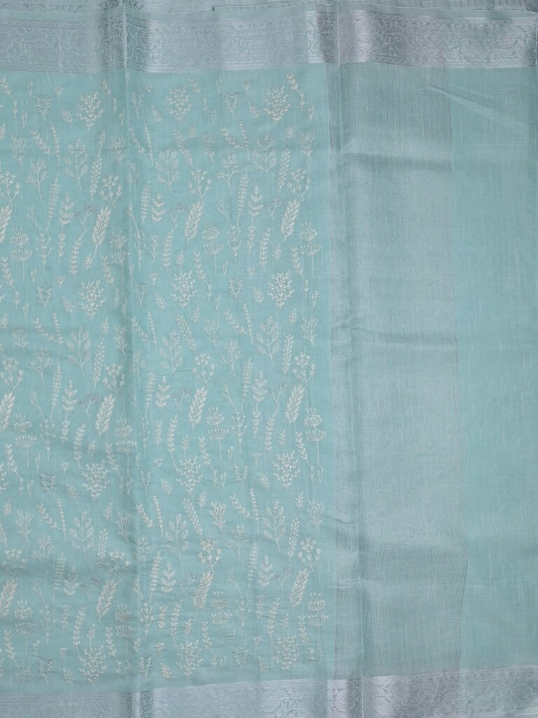 Jute tissue fancy saree sky blue color allover embroidery & zari border with short pallu and plain self blouse