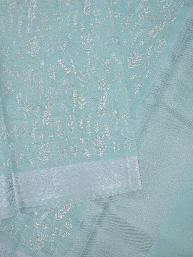 Jute tissue fancy saree sky blue color allover embroidery & zari border with short pallu and plain self blouse