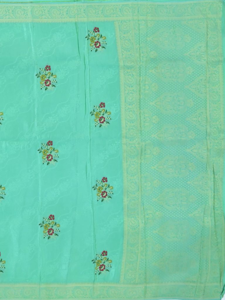 Dola tissue fancy saree sky blue color allover zari weaves & small border with rich pallu and contrast plain blouse