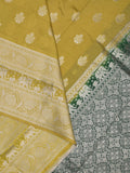 Dupion fancy saree greenish yellow color allover zari motifs & zari border with rich pallu and plain contrast blouse