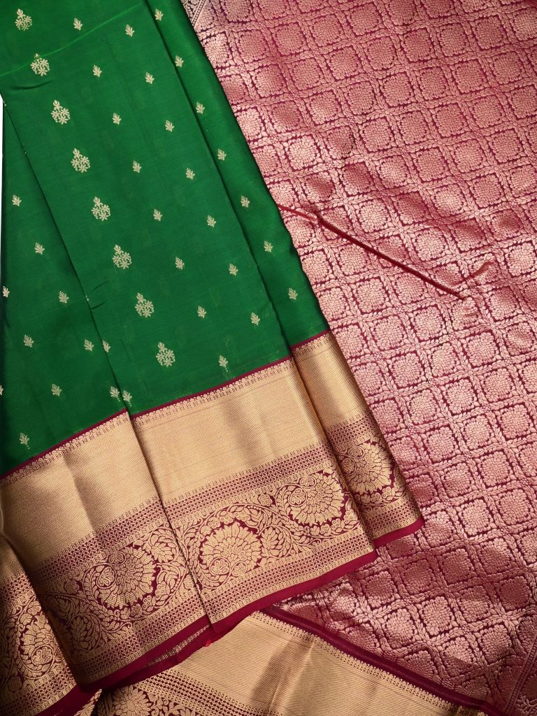 Kanchi pattu saree bottle green color allover zari motifs & big zari border with rich pallu and contrast plain bouse