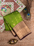 Kanchi pattu saree parrot green color allover zari motifs & zari border with rich pallu and contrast plain bouse