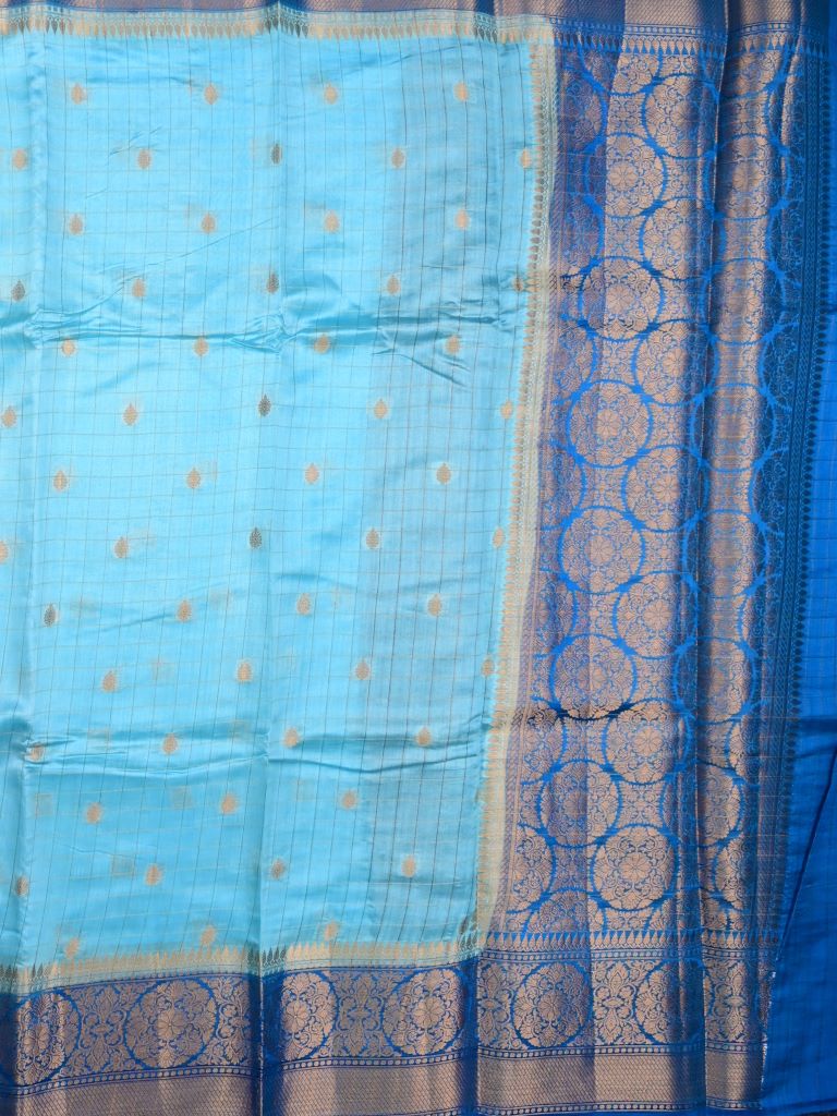 Munga pattu saree light blue color allover checks and zari motifs & zari border with short pallu and contrast brocade blouse