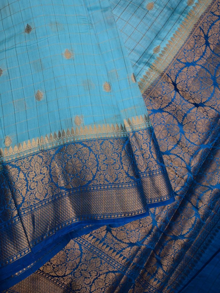 Munga pattu saree light blue color allover checks and zari motifs & zari border with short pallu and contrast brocade blouse