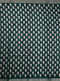 Fancy tussar saree green color with allover small flower motive prints, small zari kaddi border, short pallu and plain blouse