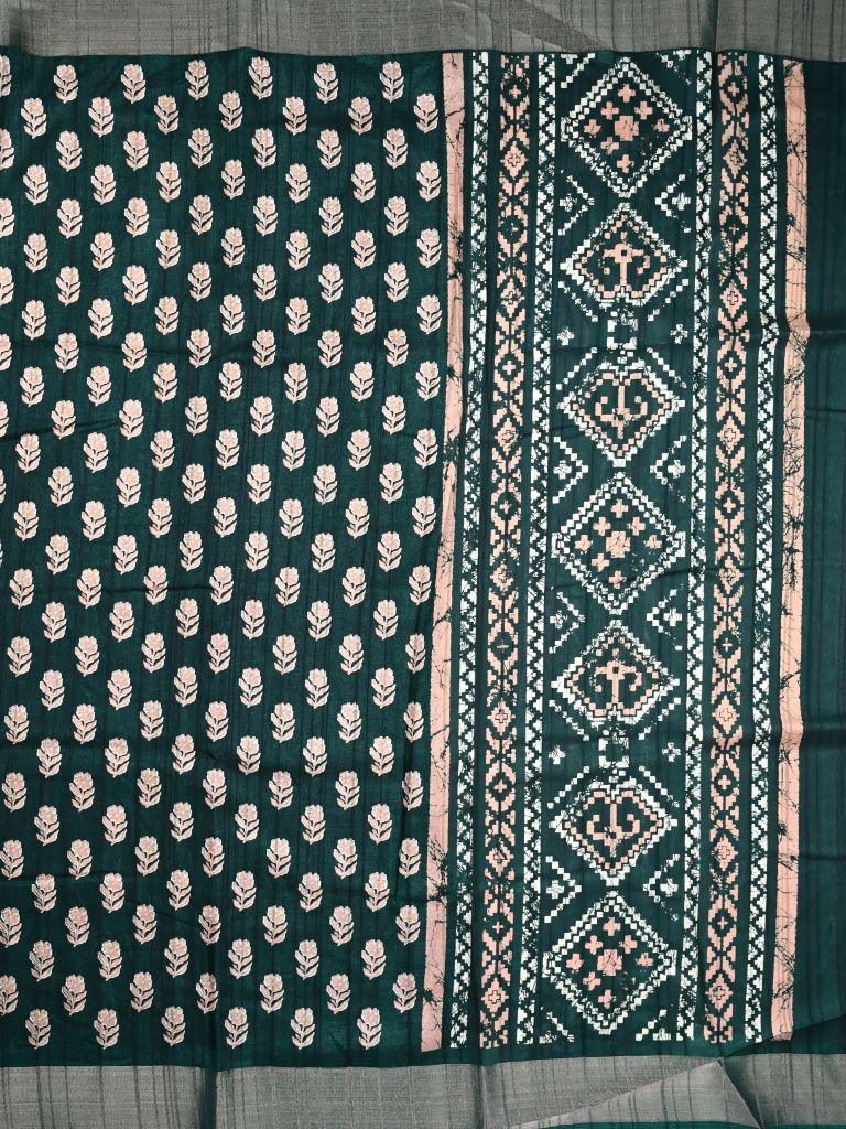 Fancy tussar saree green color with allover small flower motive prints, small zari kaddi border, short pallu and plain blouse