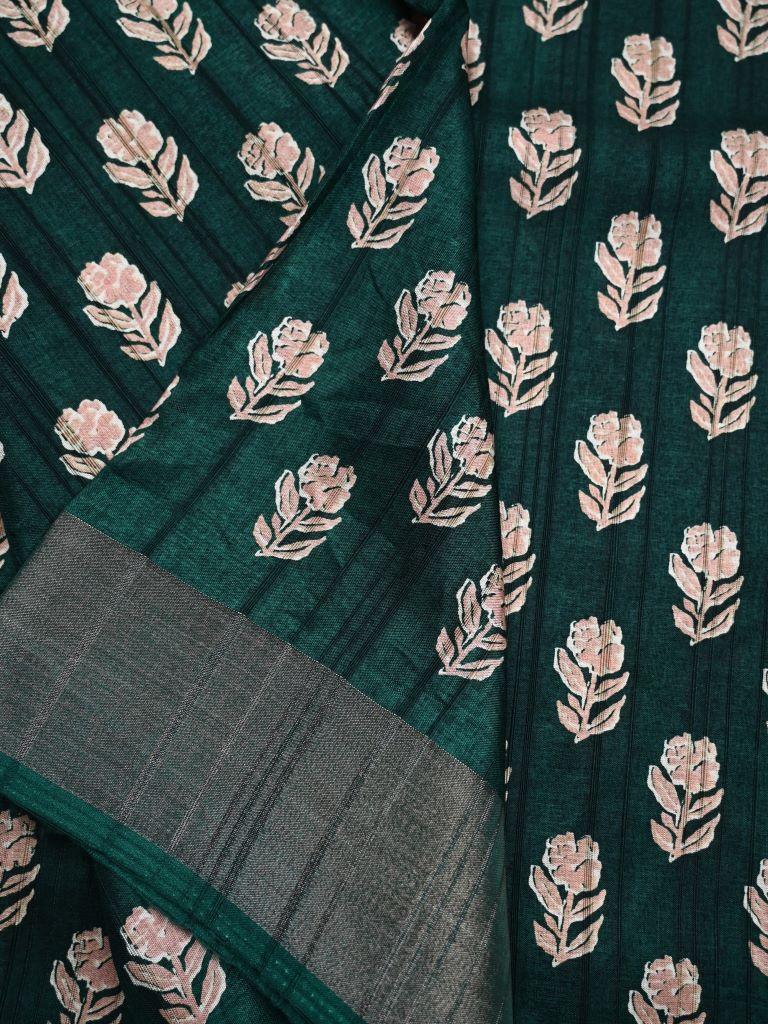 Fancy tussar saree green color with allover small flower motive prints, small zari kaddi border, short pallu and plain blouse