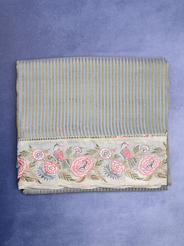 Dola tissue fancy saree grey color allover stripes & designer fancy border with running pallu and embroidery blouse