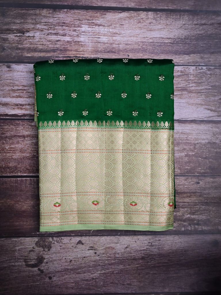 Munga pattu saree bottle green color allover zari motifs & zari border with brocade pallu and plain contrast blouse