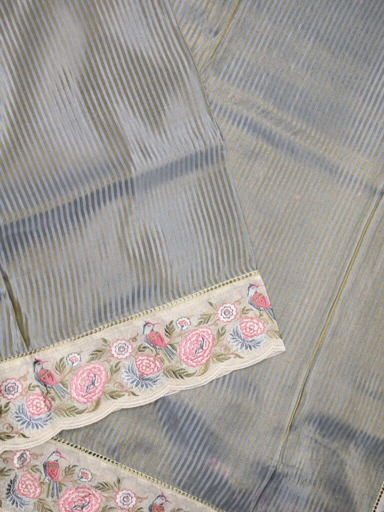 Dola tissue fancy saree grey color allover stripes & designer fancy border with running pallu and embroidery blouse