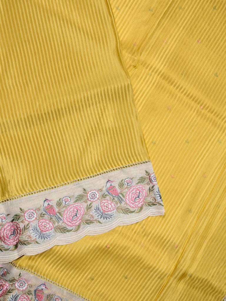 Dola tissue fancy saree yellow color allover stripes & designer fancy border with running pallu and embroidery blouse