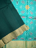 Raw silk pattu saree bottle green color allover plain & small zari border with contrast ikkath pallu and ikkath blouse