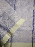 Organza tissue fancy saree light blue color allover weaves & small kaddi border with short pallu and plain blouse