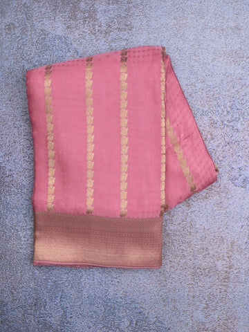 Crape fancy saree baby pink color allover zari weaves & zari border with zari pallu and plain blouse