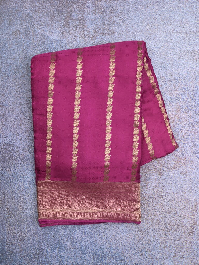 Crape fancy saree onion pink color allover zari weaves & zari border with zari pallu and plain blouse