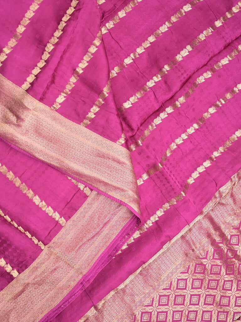 Crape fancy saree onion pink color allover zari weaves & zari border with zari pallu and plain blouse