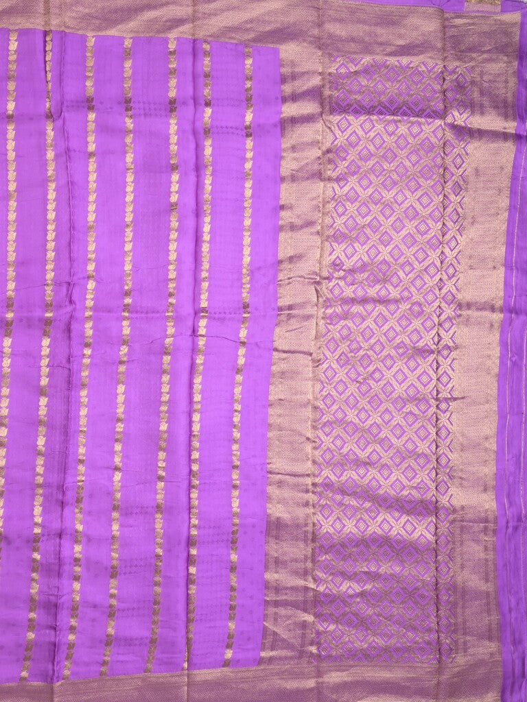 Crape fancy saree purple color allover zari weaves & zari border with zari pallu and plain blouse