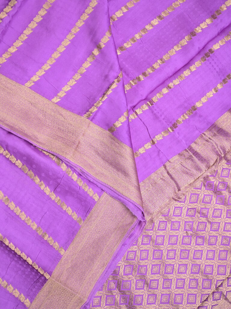 Crape fancy saree purple color allover zari weaves & zari border with zari pallu and plain blouse