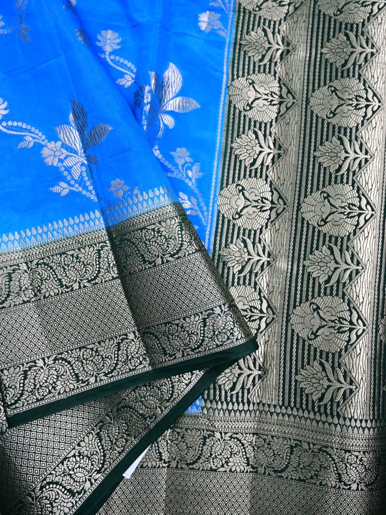 Dupion fancy saree sky blue color allover zari weaves & zari border with rich pallu contrast brocade blouse