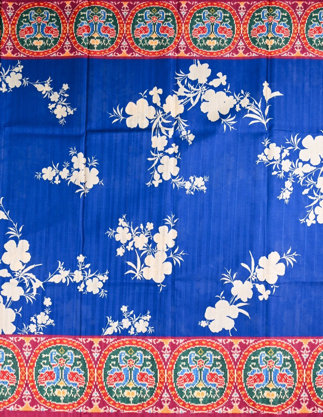 Tussar saree blue color with allover floral prints, big pallu, with printed border and blouse