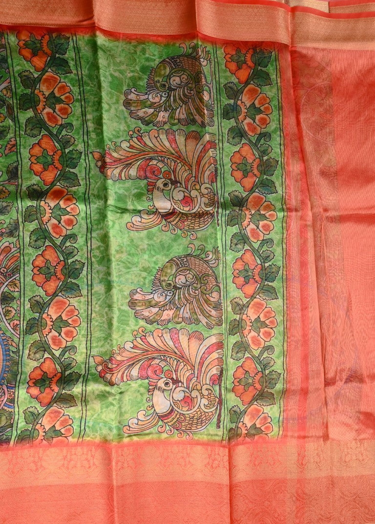 Chiniya silk saree green and orange color with allover digital kalamkari prints, short pallu, big zari border and plain blouse