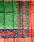 Dupion patola saree green color with allover digital kalamkari prints, short pallu, big zari border and printed blouse.