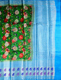 Matka jute saree green and blue color with allover digital prints with antique zari motives, short pallu, zari border, and brocade blouse