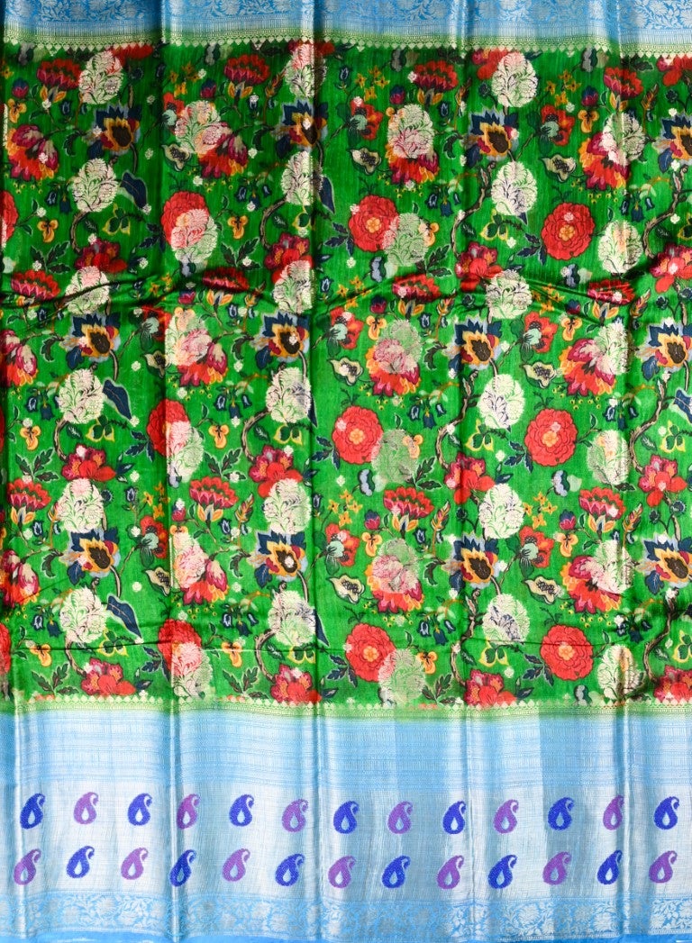 Matka jute saree green and blue color with allover digital prints with antique zari motives, short pallu, zari border, and brocade blouse