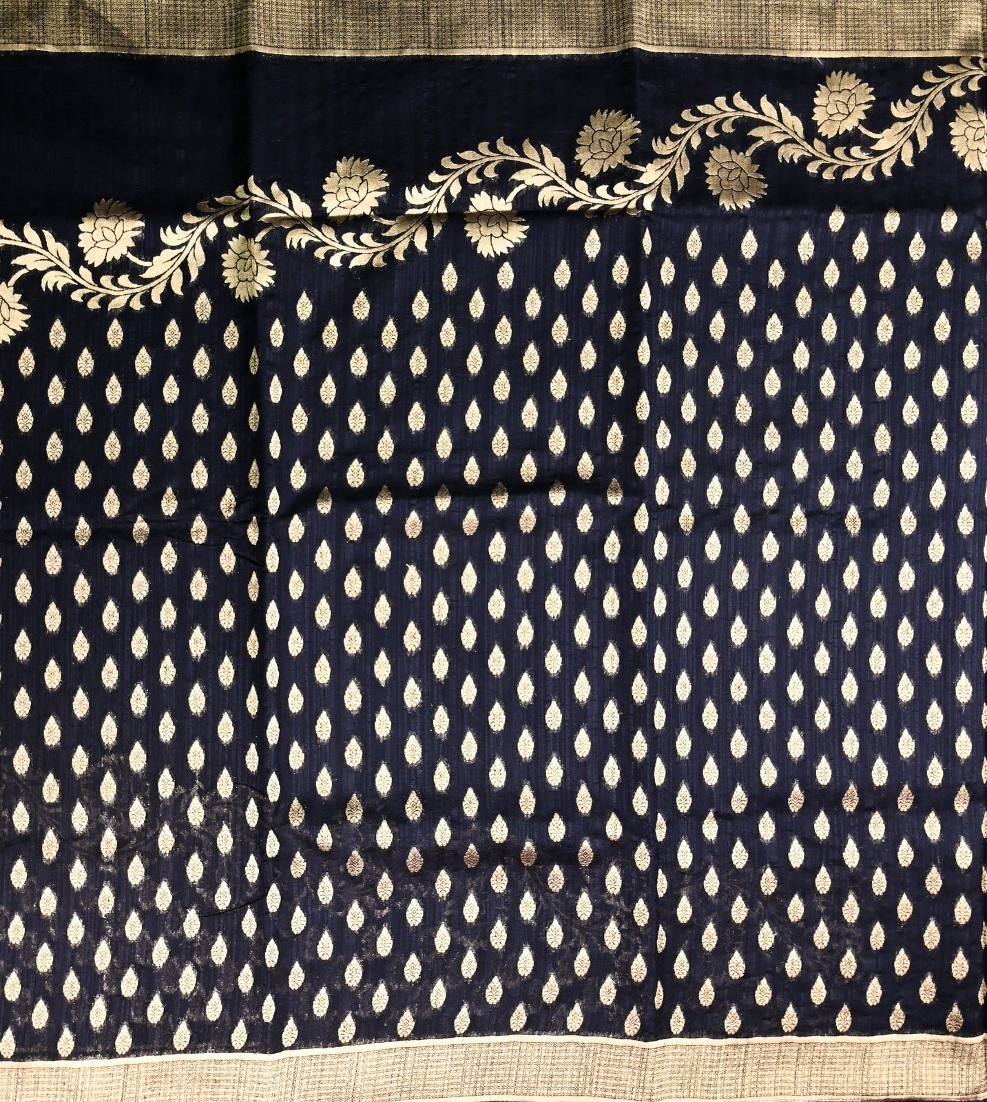 Dupion fancy saree black color with allover gold zari motive weaves, short pallu, zari border with plain blouse
