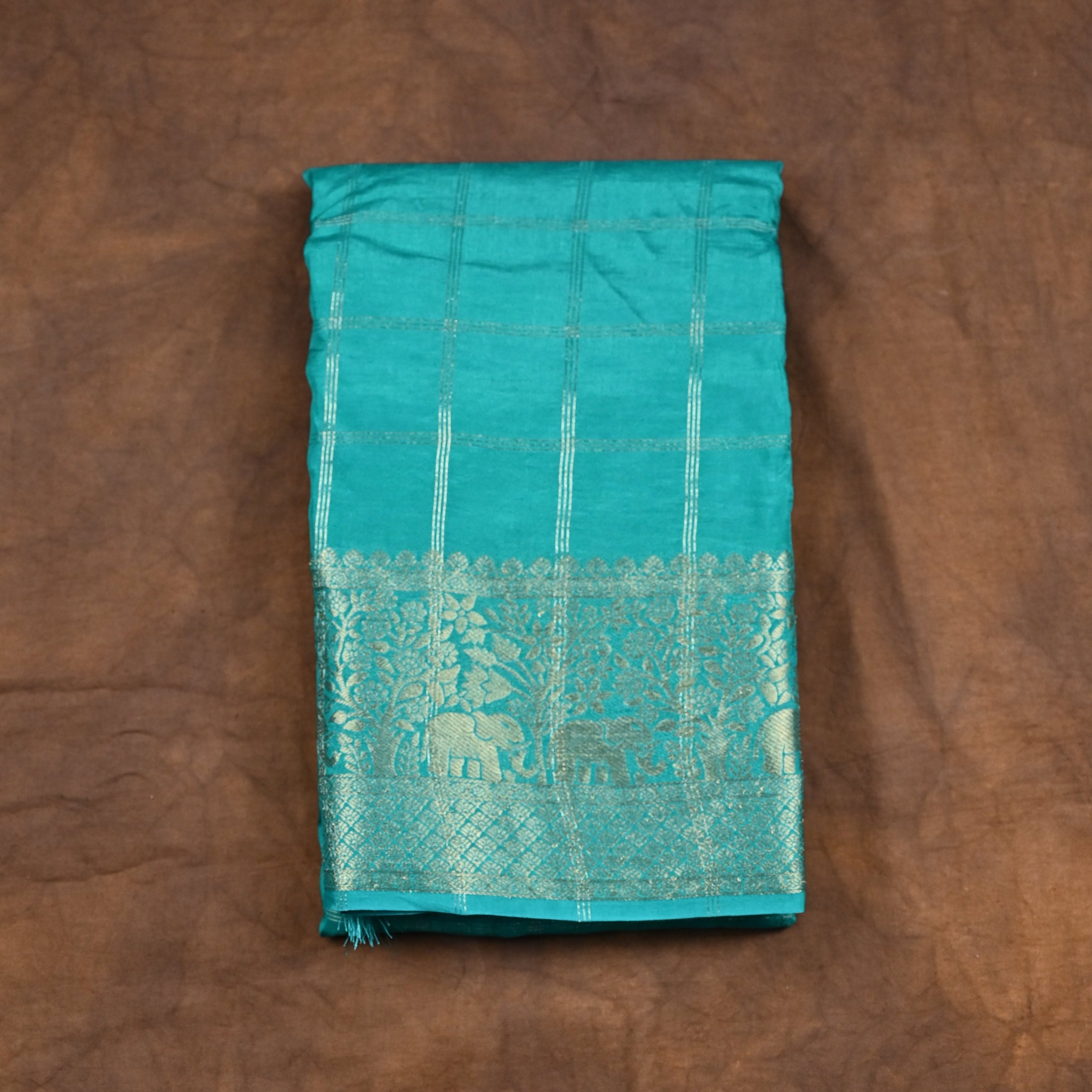 Dola silk saree sea green color with allover zari checks, big zari border, short pallu and brocade blouse