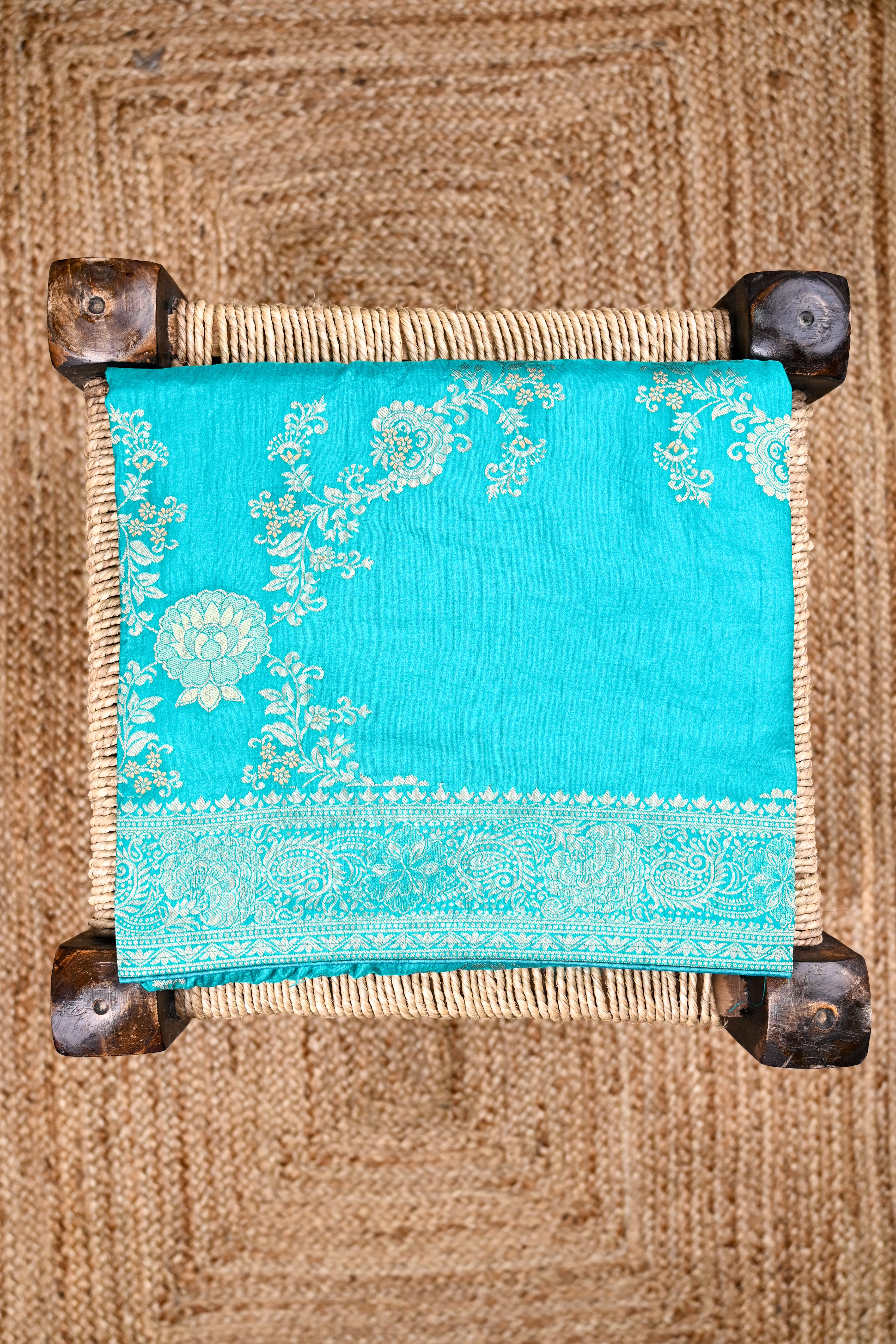 Dola silk saree sea blue color with allover meenakari work, rich pallu, small zari border and running plain blouse.