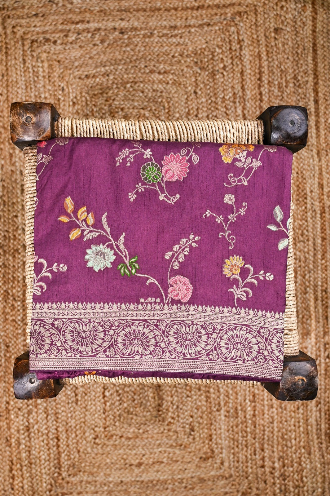 Dola silk saree plum color with allover zari work, rich pallu, small zari border and running plain blouse.