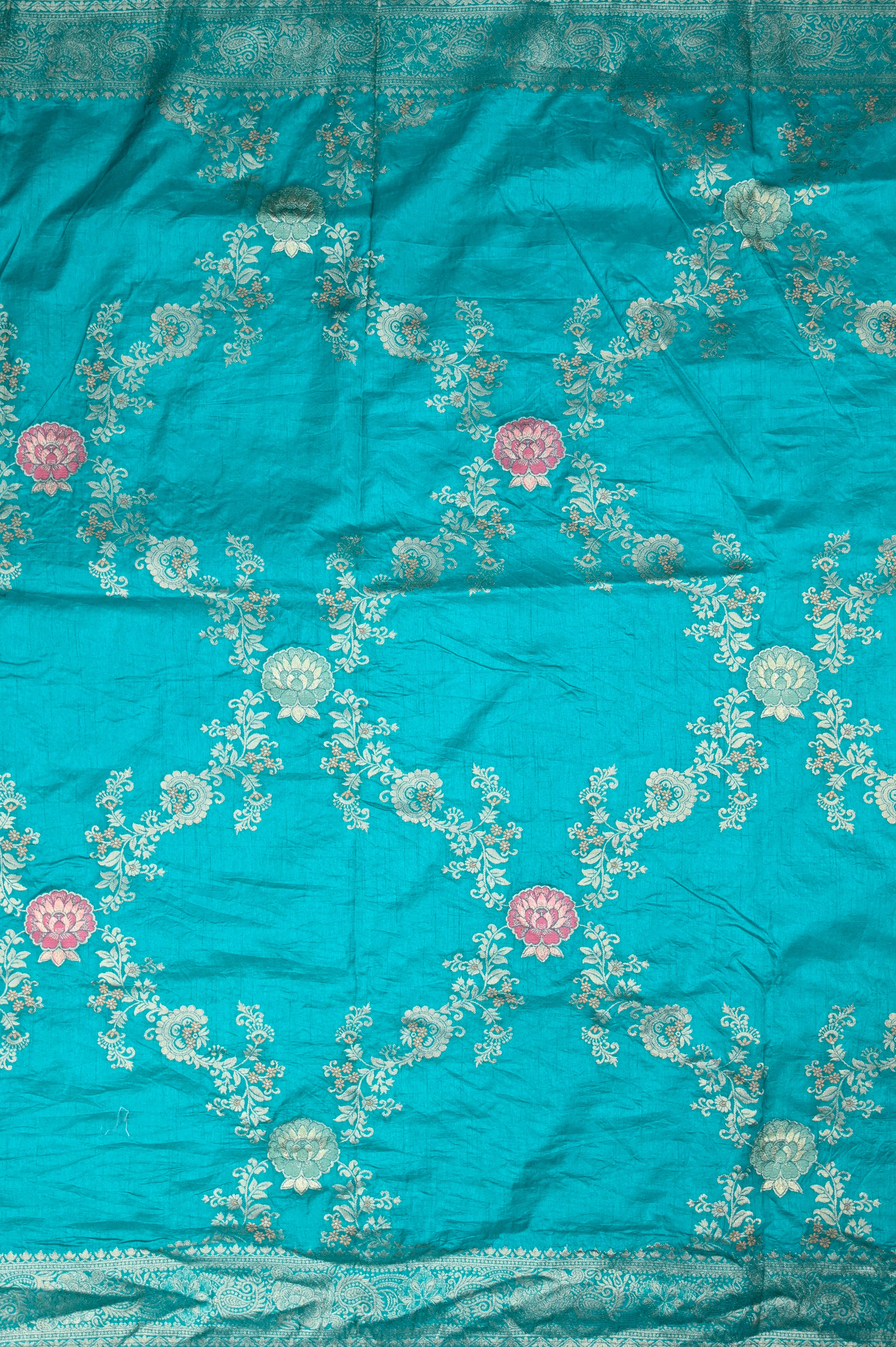 Dola silk saree sea blue color with allover meenakari work, rich pallu, small zari border and running plain blouse.