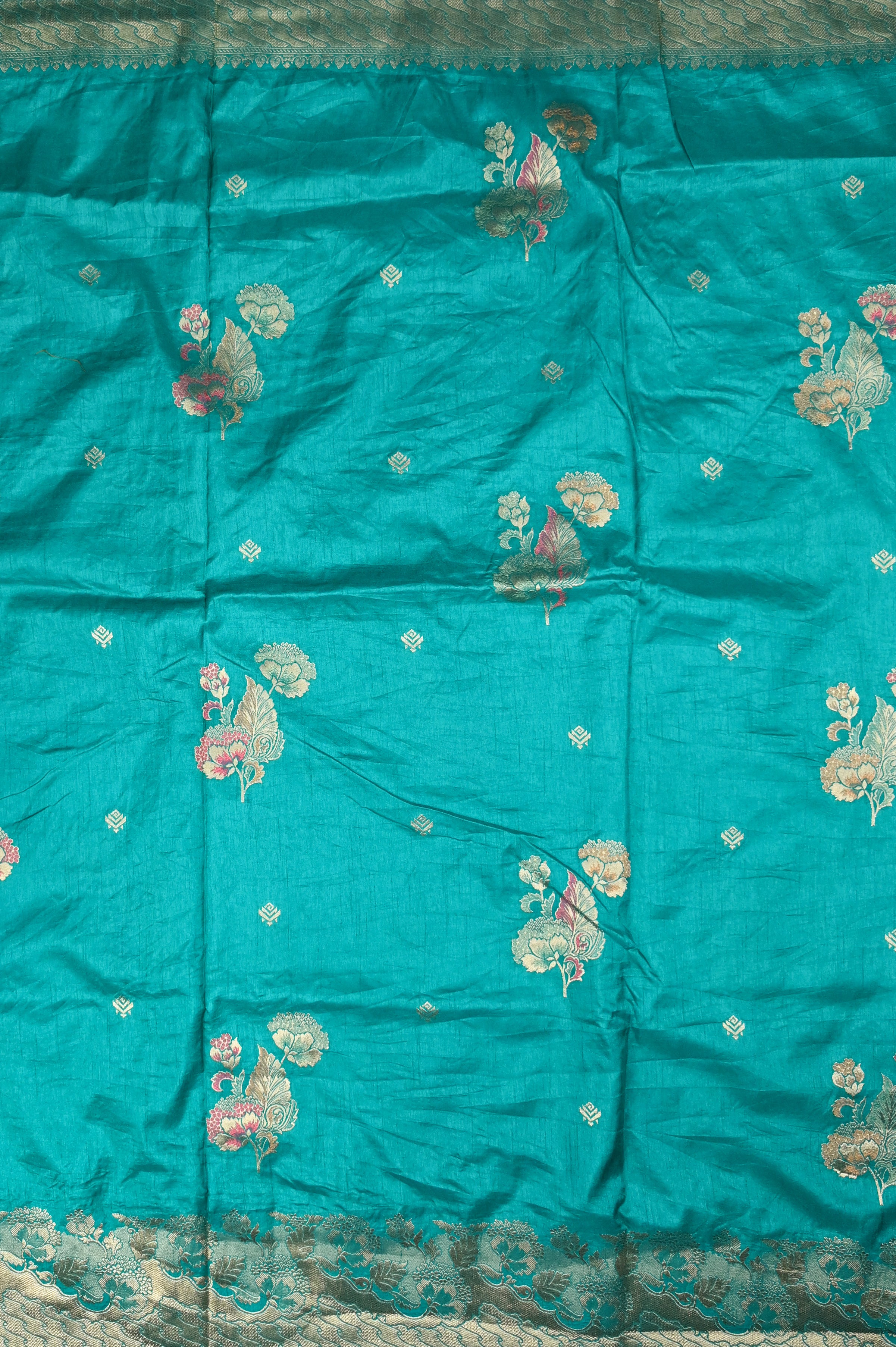 Dola silk saree sea green color with allover meenakari motives, rich pallu, small zari border and running plain blouse.