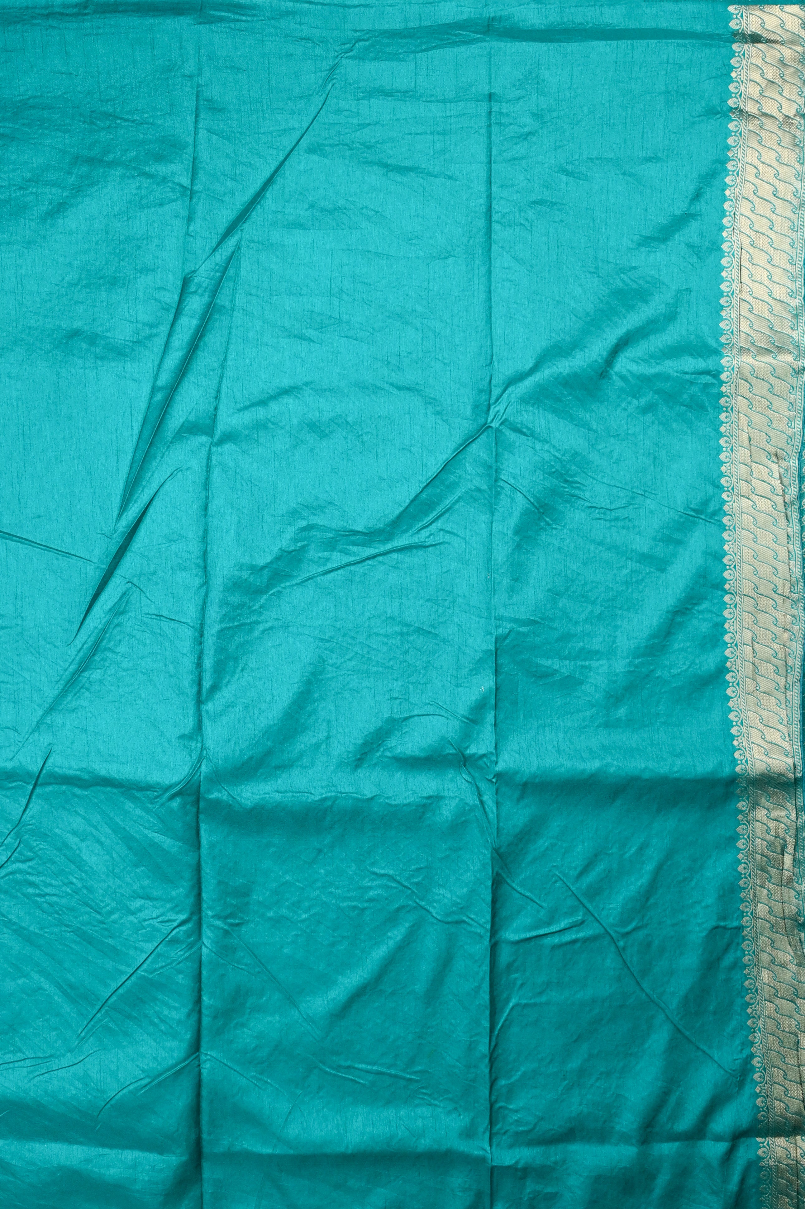 Dola silk saree sea green color with allover meenakari motives, rich pallu, small zari border and running plain blouse.