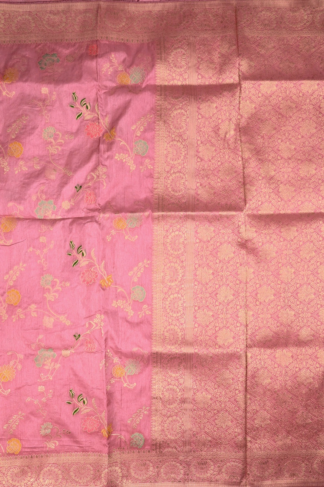 Dola silk saree light onion pink color with allover zari work, rich pallu, small zari border and running plain blouse.