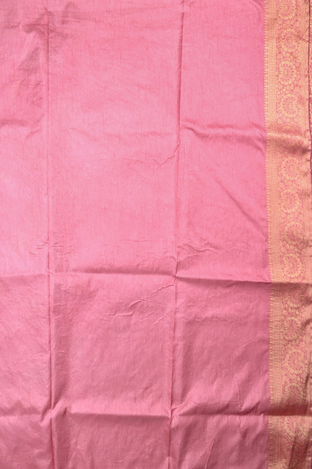 Dola silk saree light onion pink color with allover zari work, rich pallu, small zari border and running plain blouse.