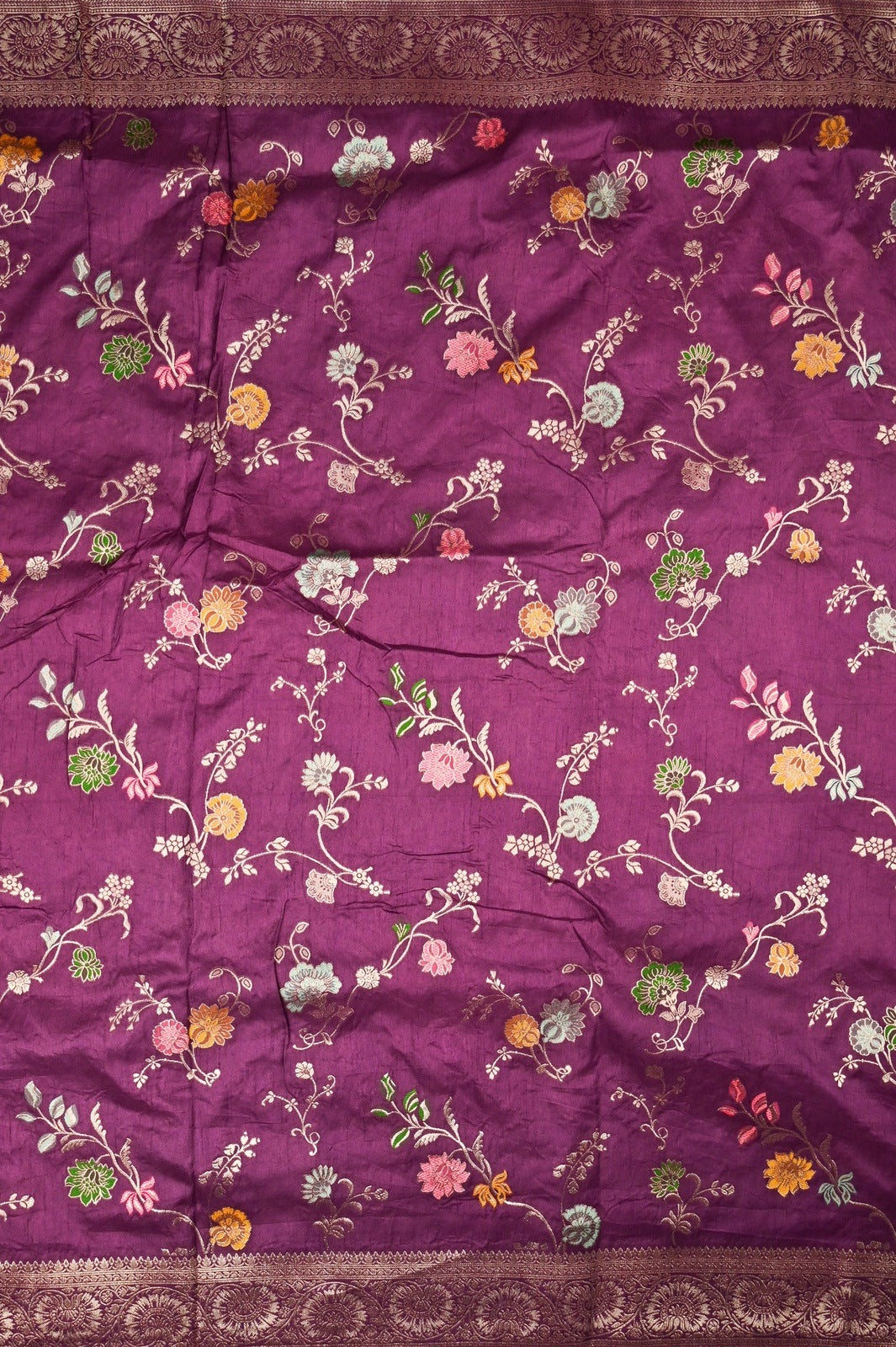 Dola silk saree plum color with allover zari work, rich pallu, small zari border and running plain blouse.